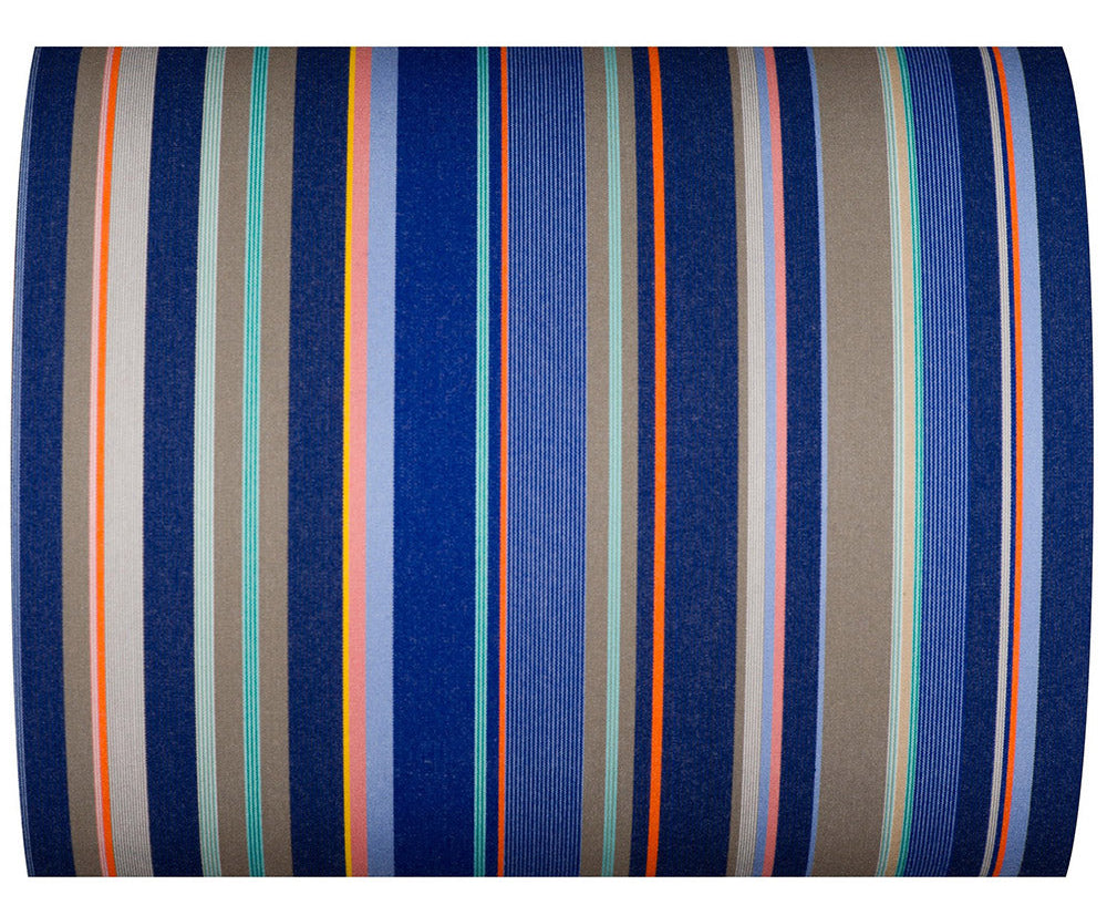 Close up of waterproof acrylic Sunbrella fabric featuring shades of blw stripes with detail, taupe, orange, turquoise, and a pop of pink.