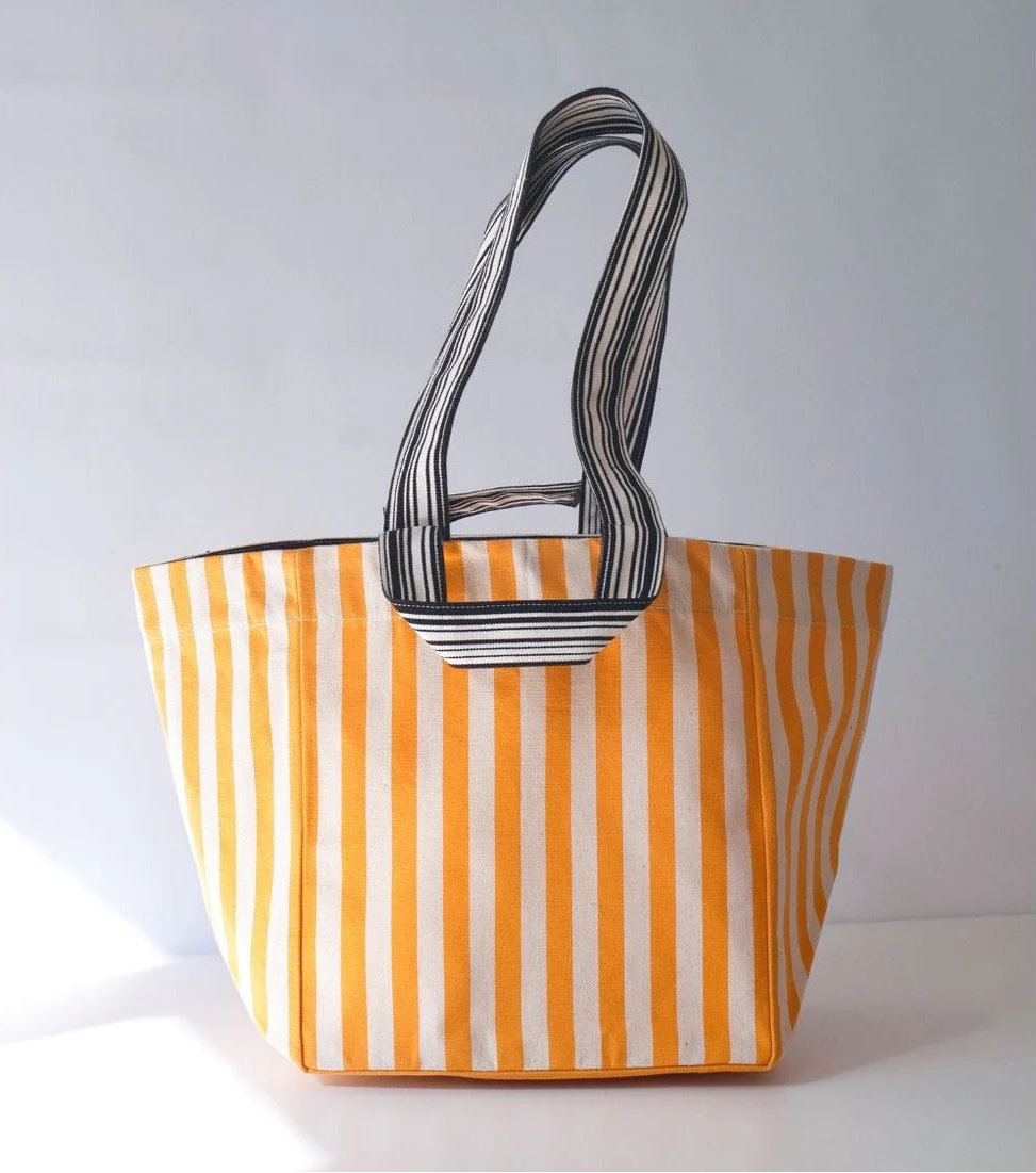 Shoulder carry bag made in Isola Bella - a 43cm fabric cotton roll made by Les Toiles do Soleil. It is striped in saffron yellow and off white.