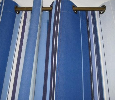 Close up of curtain made from Rue du Bac Bleu cotton with multiple shades of striped blue.