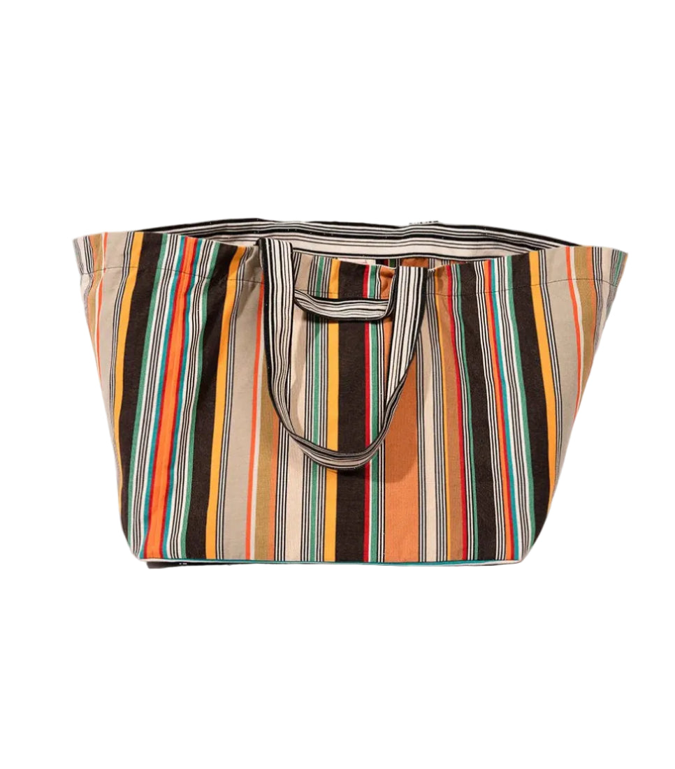 Large shoulder tote carry bag made with cotton fabric featuring densely woven stripes of orange, dark brown, golden yellow, teal, sand, olive, red and cream, with fine black and white pin lines throughout and bright orange selvedge edges.