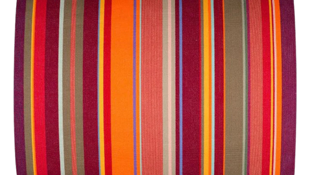 Colourful striped fabric with red, orange, and multicolour stripes on a white background