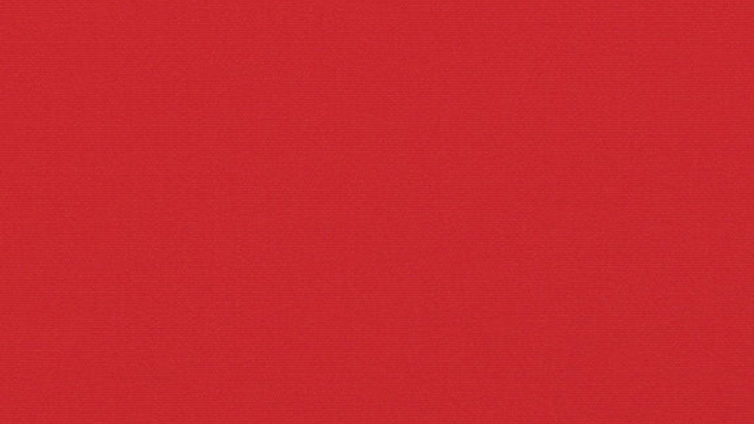 A solid red Sunbrella outdoor fabric with a textured appearance, likely designed for use in outdoor settings such as awnings or chair covers.