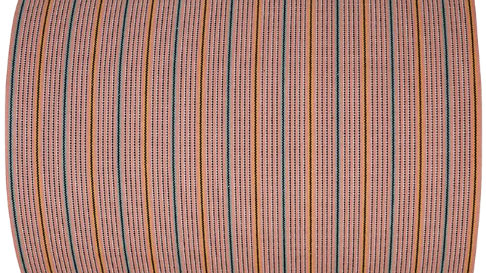 Close-up of the 1897 No.1 fabric roll showing woven vertical stripes in soft pink, red, beige, and cream tones with a textured linen-cotton weave. Made by Les Toiles du Soleil
