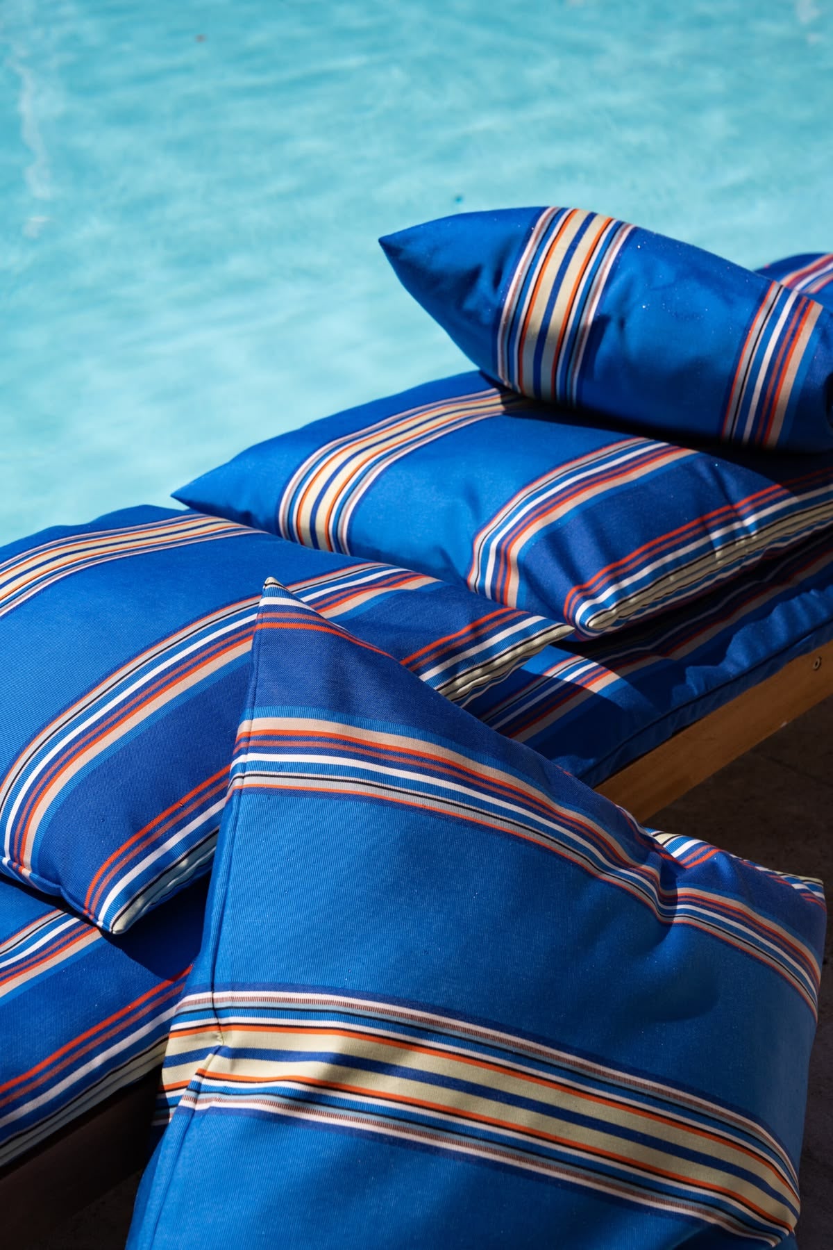 Alexandre mixed blue striped Sunbrella and Les toile du Soleil exterior cusions