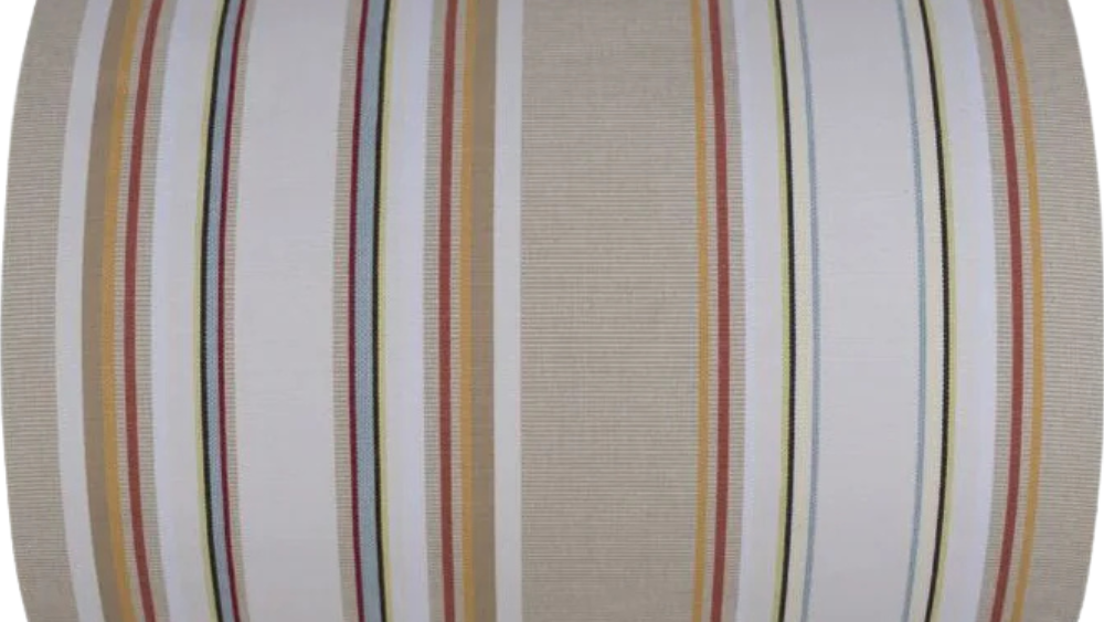 Striped cotton fabric roll featuring soft browns, beige, white, blue and yellows. On a white back ground.