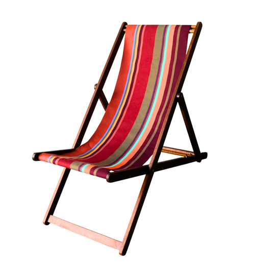 Hardwood folding deckchair featuring multiple stripes of red, orange teal, burgundy, and green striped cotton fabric. On a white background.