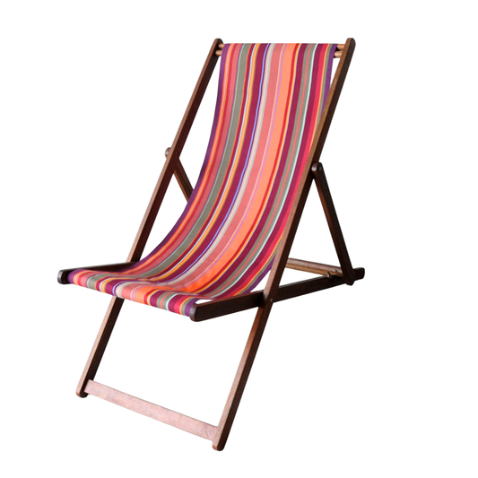 Hardwood folding deckchair featuring striped cotton fabric featuring red, orange, and purple colours, 43cm in width made by Les Toiles du Soleil. On a white background.