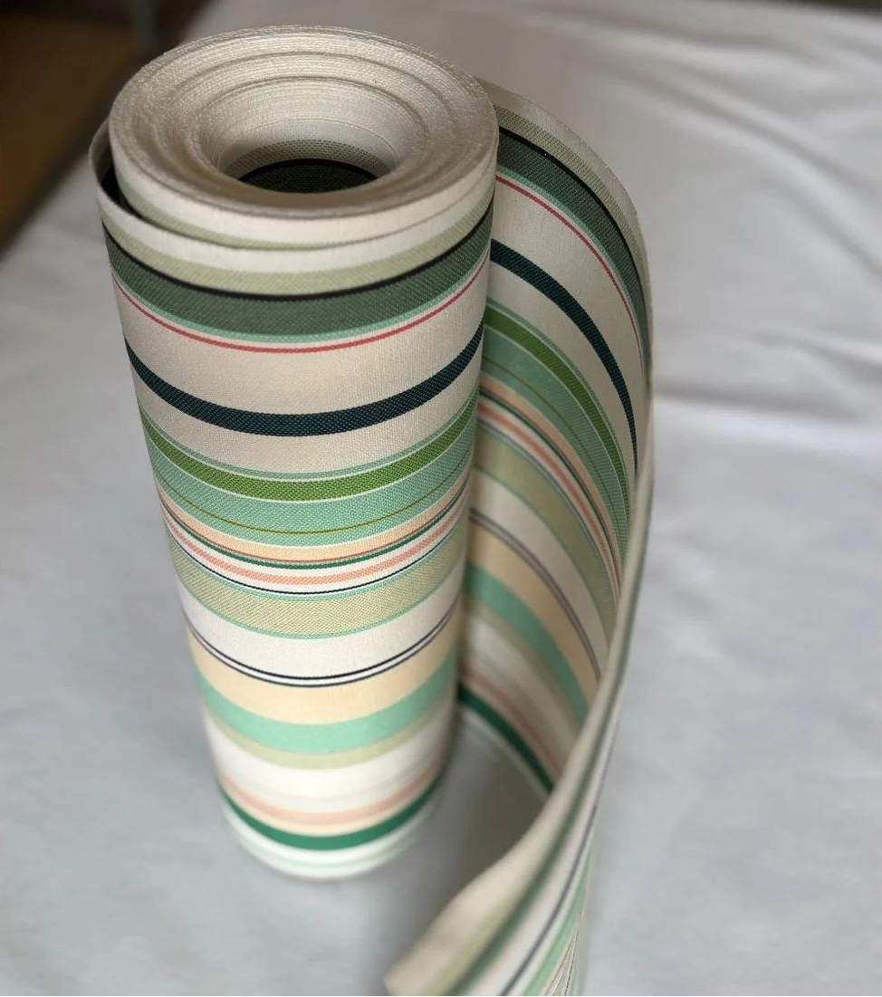 Bompas cotton fabric roll by Les Toiles du Soleil. Featuring soft hues of striped greens, turquoise, blush pink and white. Place on a white background