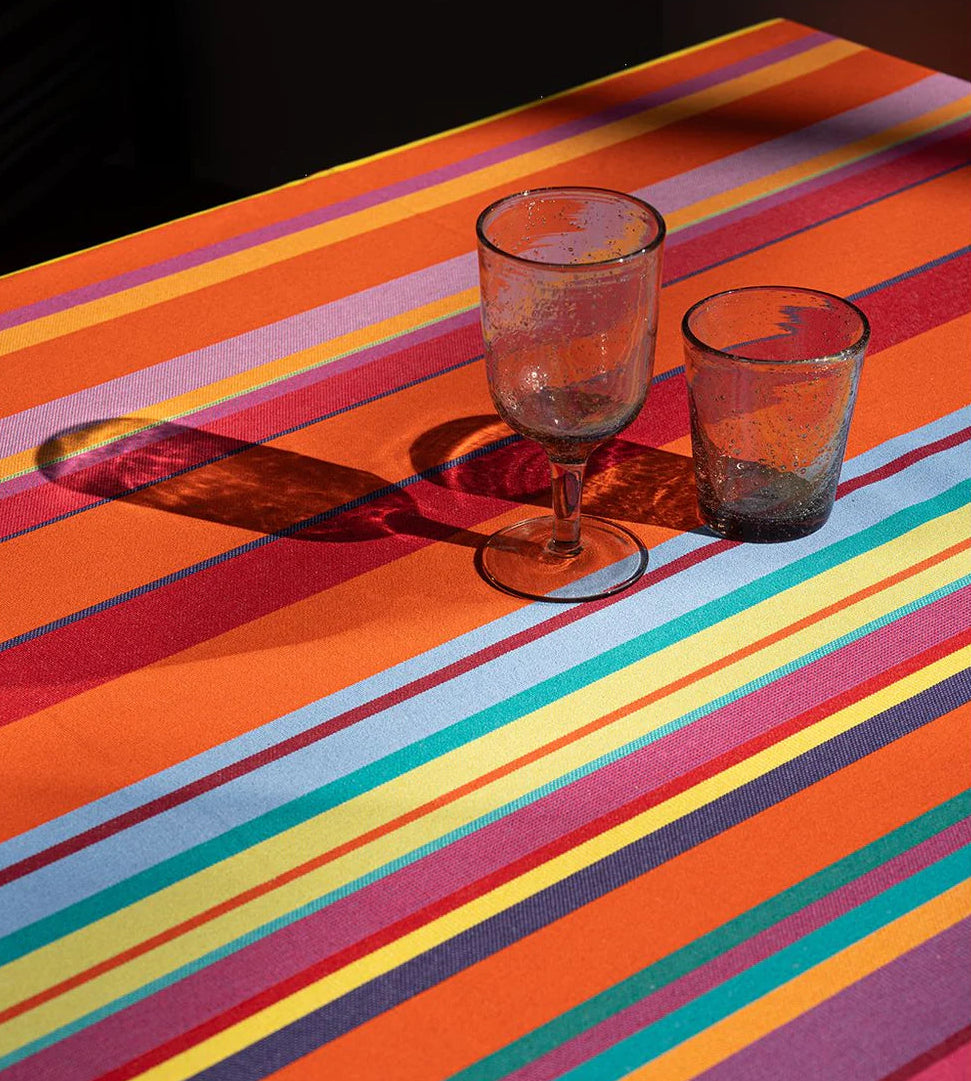 Bonbon Plume sunbrella outdoor fabric table linen. Multiple coloured stripes.