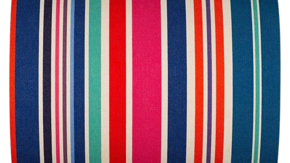 Cotton roll featuring bold stripes of navy, red, fuchsia, orange, teal, green, cream and purple, with a fine orange selvedge edge.