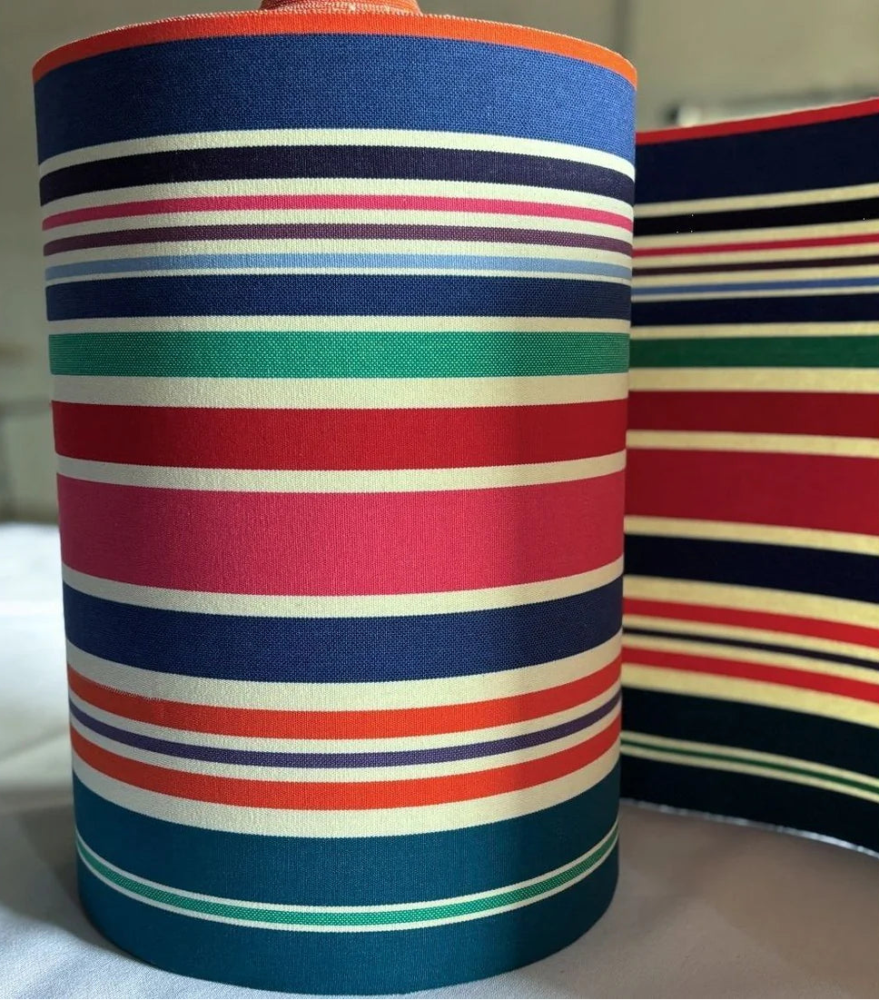 Cotton roll featuring bold stripes of navy, red, fuchsia, orange, teal, green, cream and purple, with a fine orange selvedge edge.