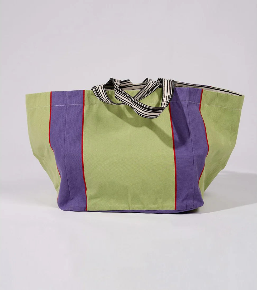 Large shoulder carry bag made from  Camino Violet cotton fabric. Featuring a bold middle stripe in lime with purple edges. Between the lime and purple is a thin fuchsia/red stripe. 