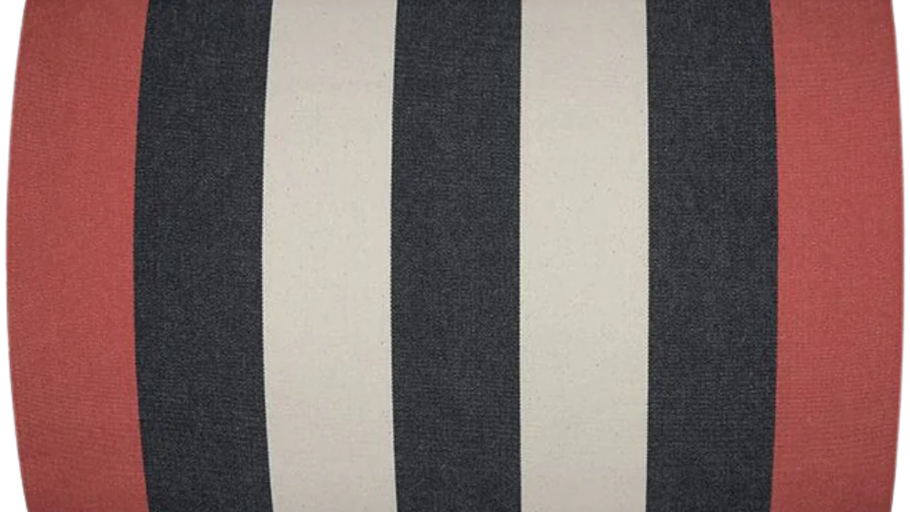 Fabric roll of Bold black and ecru/beige stripes in-between red edges