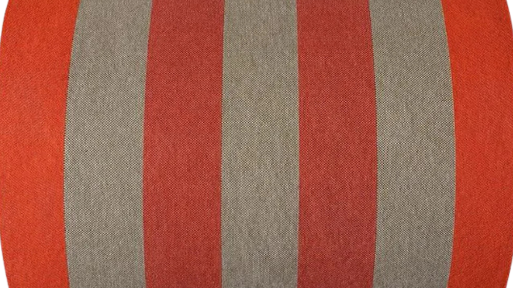 Carthage Tomette Orange fabric roll featuring a bold stripes of red, orange red, and beige/brown. A detailed 100% cotton weave by By Les Toiles du Soleil