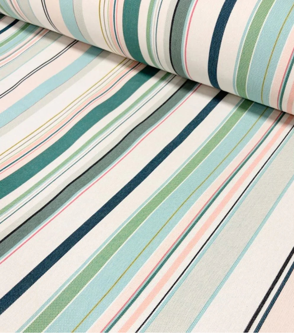 Close up of Les Toiles du soleil Bompas range of indoor cotton fabric roll. This multi coloured striped fabric palette is made up of greens, light blues, soft pinks and white 