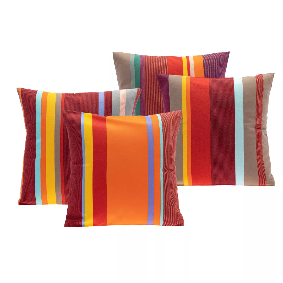 Set of colourful Les Toiles du Soleil exterior striped cushions on a white background