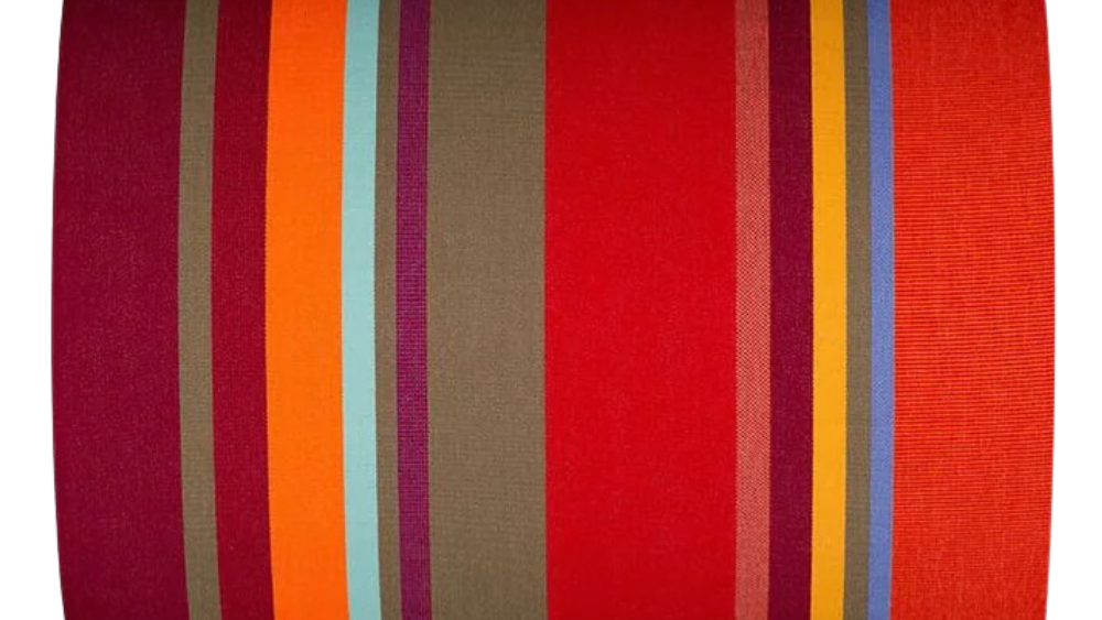 Cotton fabric roll thumbnail featuring multiple stripes of red, orange teal, burgundy, and green striped cotton fabric. 