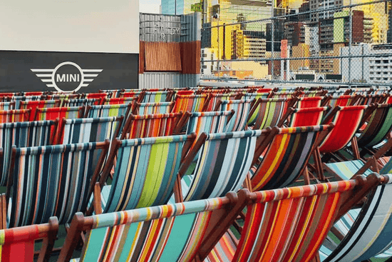 Ici et la colourful deckchairs at the Curtain House Rooftop cinema