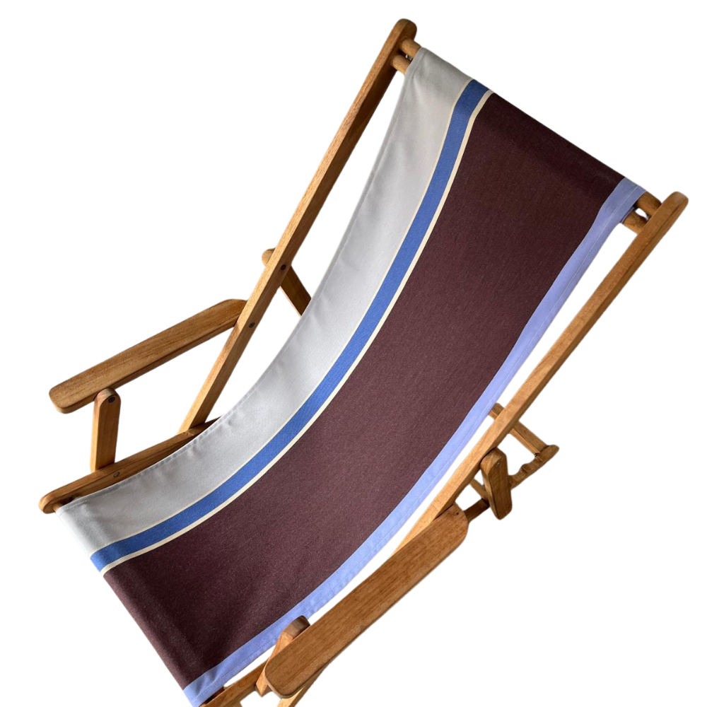 A teak folding deck chair with a fabric seat featuring a dark brown center, a white upper section, and blue stripe accents, shown against a plain white background.