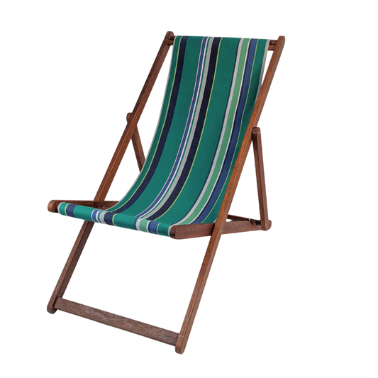A wooden folding deck chair with a striped fabric sling in shades of green, blue, navy, and grey, shown against a plain white background.