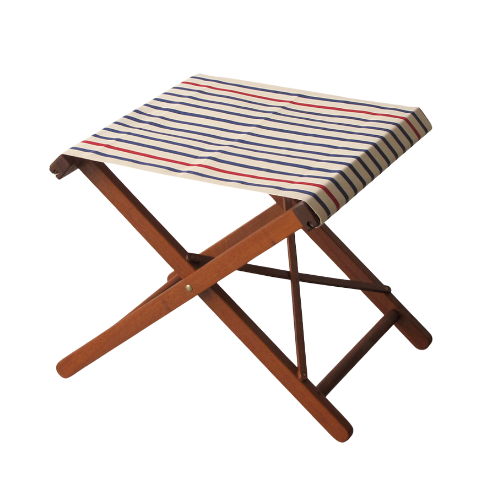 Hardwood folding stool with Les Toiles du Soleil cotton red, white, blue striped fabric. Background white