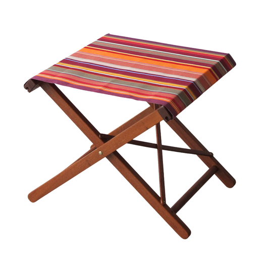 Hardwood folding stool with colourful striped cotton fabric with vertical red, orange, and multicoloured stripes on a white background