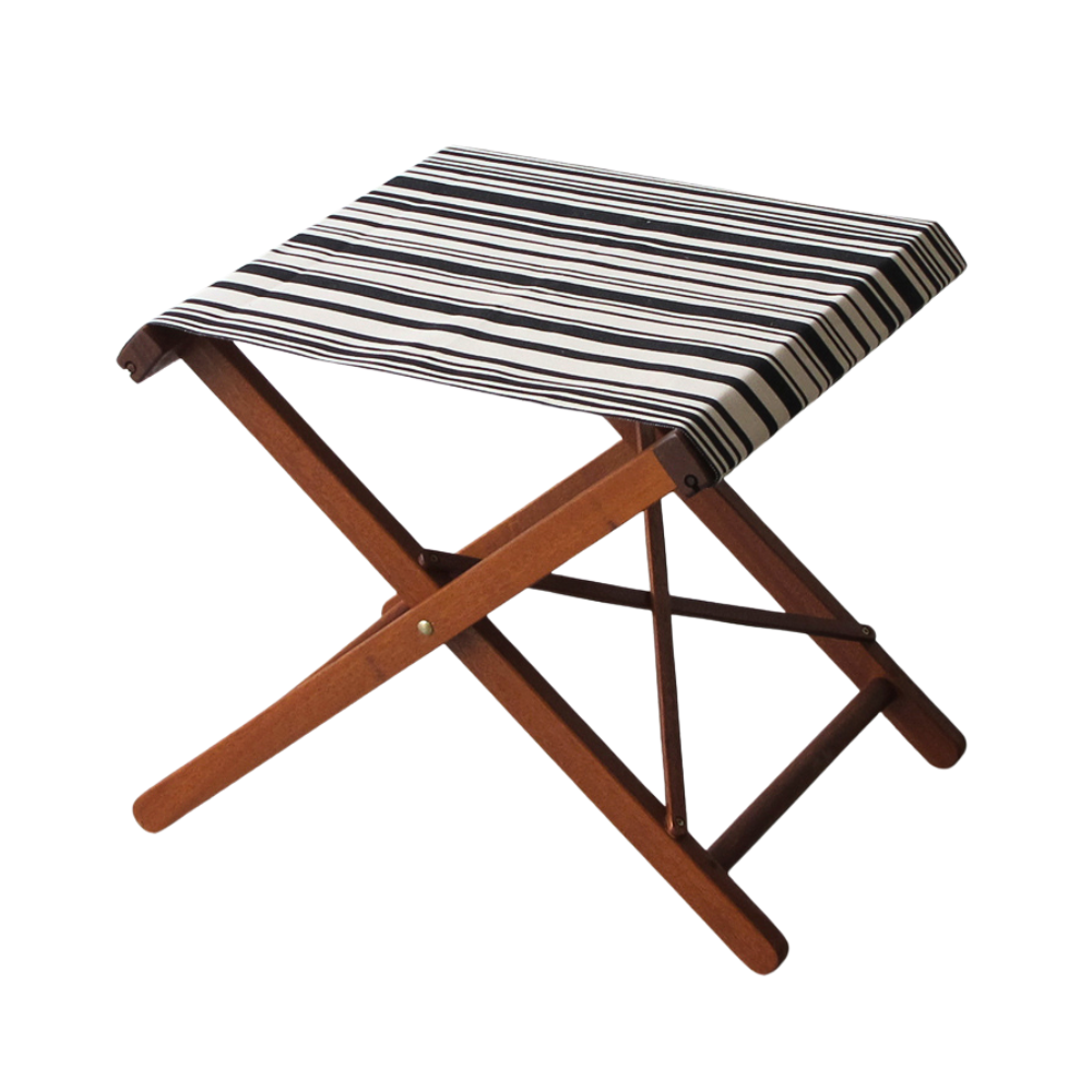 A folding hardwood stool with a striped cotton fabric in black and white barcode stripe. On a white background
