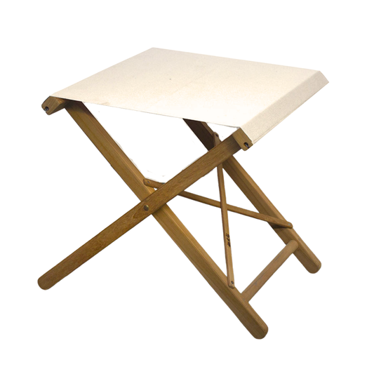 A folding teak stool with a white cotton Oxford fabric seat and a wooden frame, displayed against a plain background.