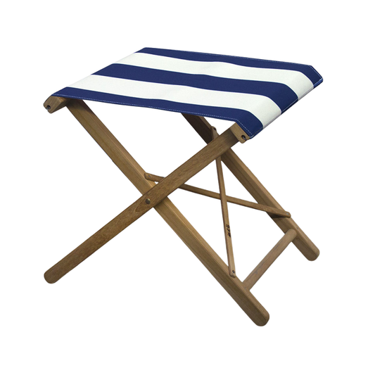 A folding stool with a teak frame and synthetic navy and cream striped fabric.