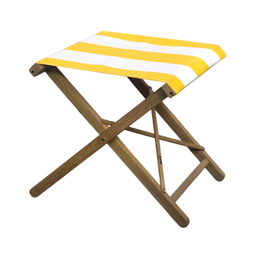 Teak folding stool with bold striped yellow and white Sunbrella acrylic fabric. Positioned on a neutral background