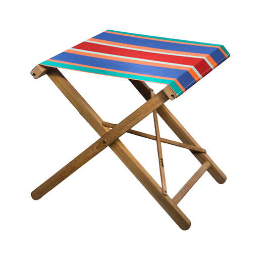 A folding teak stool with acrylic multicoloured striped sunbrella canvas seat and backrest, displayed against a neutral background.