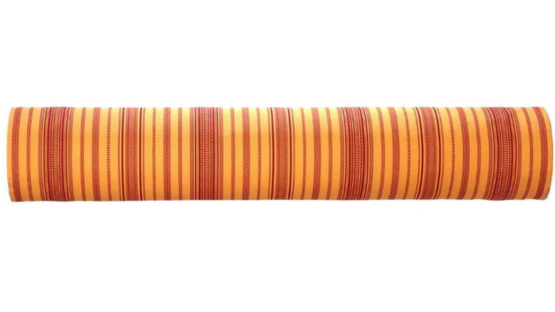 100% cotton fabric roll of Grenade Safran by Les Toiles du Soleil. Intricate woven stripes of burgundy and saffron textured fabric