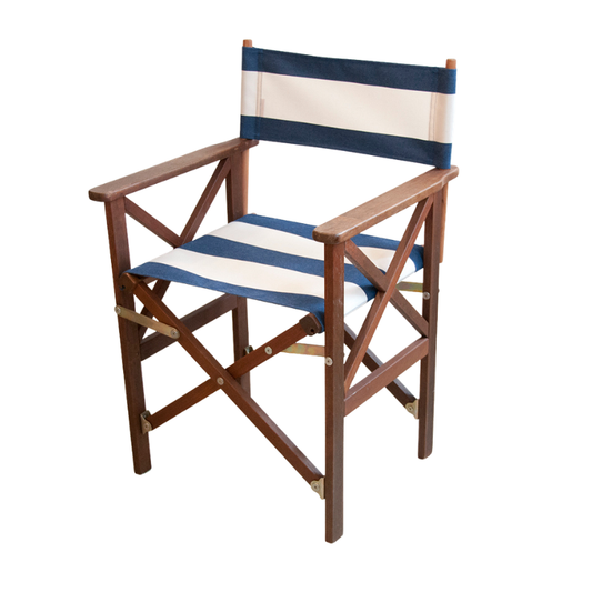 A director's chair with a wooden frame and navy and cream coloured acrylic Sunbrella fabric.