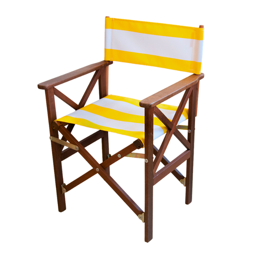 A foldable director's chair with an acrylic waterproof Sunbrella yellow and white striped fabric seat and a hardwood frame.