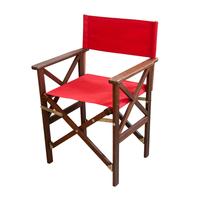 A hardwood directors chair with solid red seat and backrest acrylic waterproof fabric. Standing against a white background.