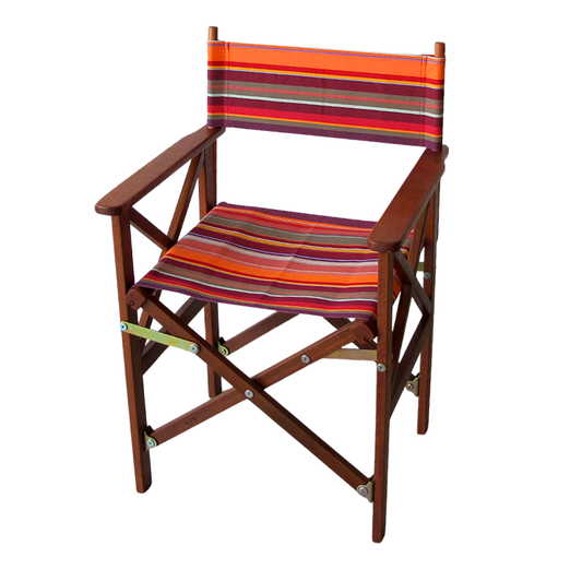 A folding director's chair with a brown hardwood frame and a seat covered in a bright red, orange, and yellow striped waterproof acrylic Sunbrella fabric.
