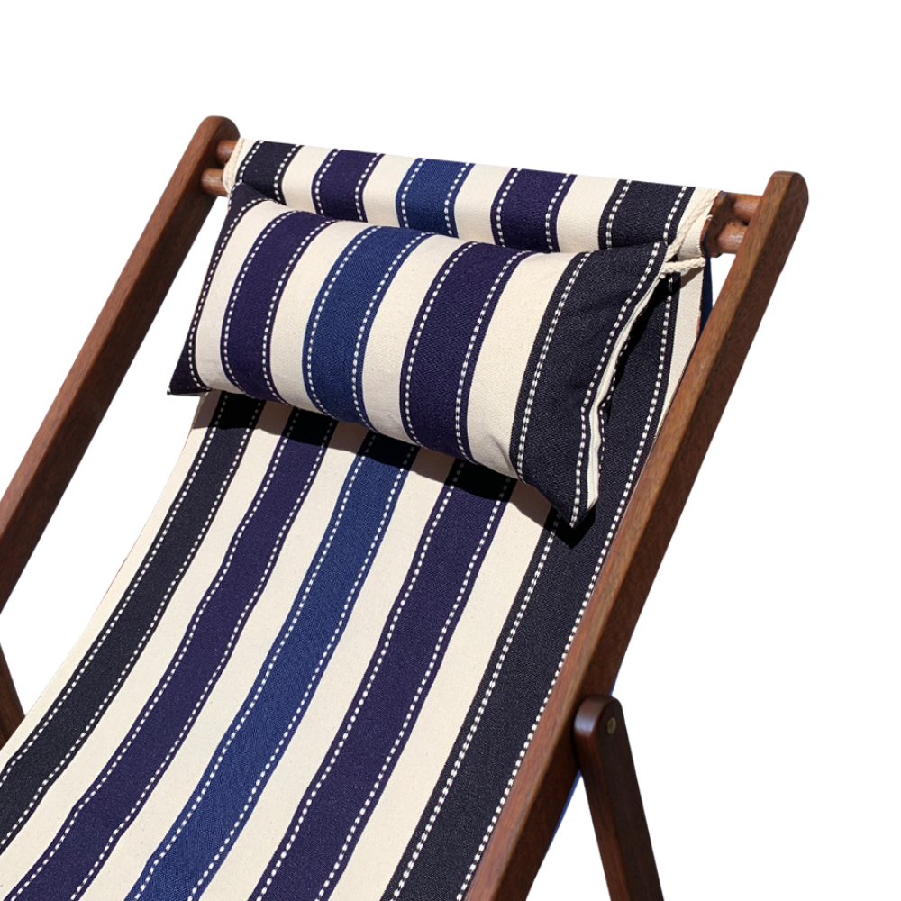 Hardwood deck chair cushion and matching pillow featuring a striped pattern with various bands in different shades of blue. A detailed 100% cotton weave by by Les Toiles du Soleil. On a white background