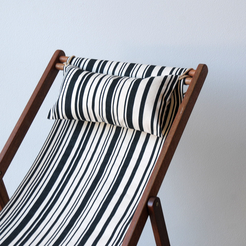 ici et la deckchair with head pillow made from 43cm cotton Tom Black fabric featuring a multicoloured striped pattern of black and white. A barcode-inspired look by Les Toiles du Soleil