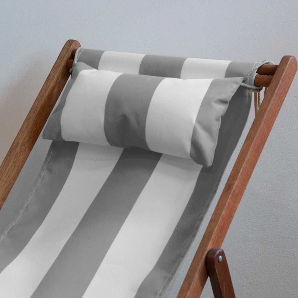 Ici et La foldable deckchair in a hardwood frame with head pillow in Sunbrella light grey and white striped fabric sling