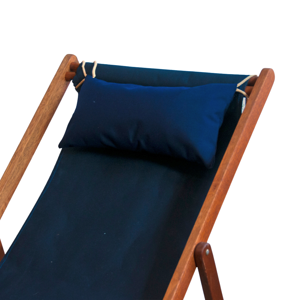A wooden folding deck chair with a dark navy blue fabric sling seat and back, featuring a matching navy blue headrest pillow secured by white rope ties, shown against a plain white background.