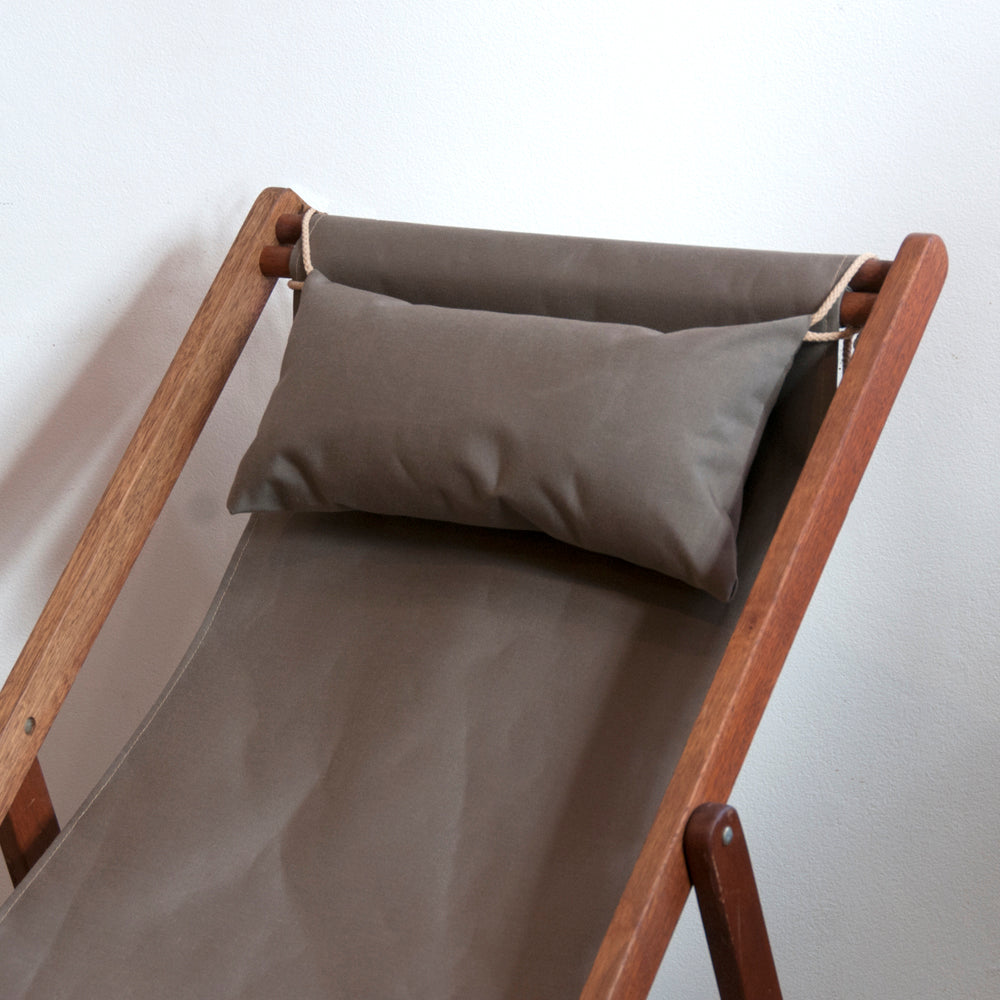 Taupe coloured Sunbrella farbic on ici et la deckchair with matching head pillow