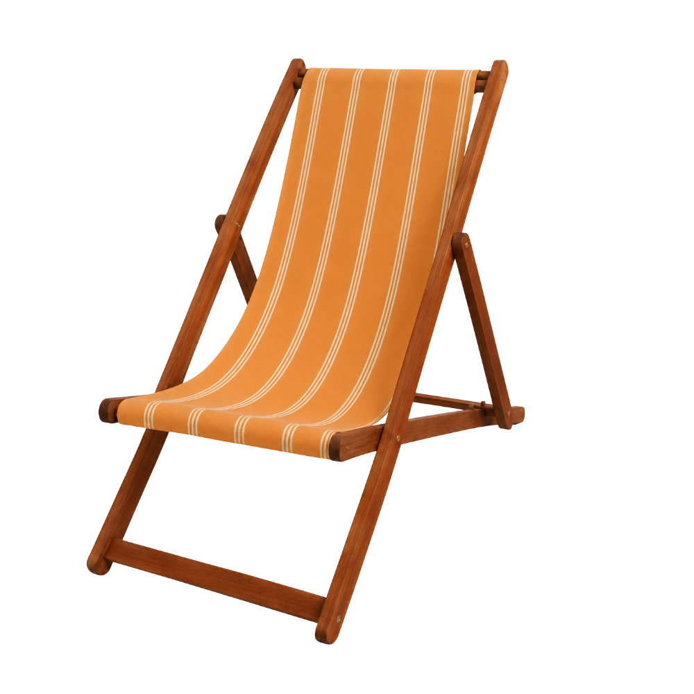 Hardwood deckchair with a peach and cream striped sunbrella fabric. On a plain background