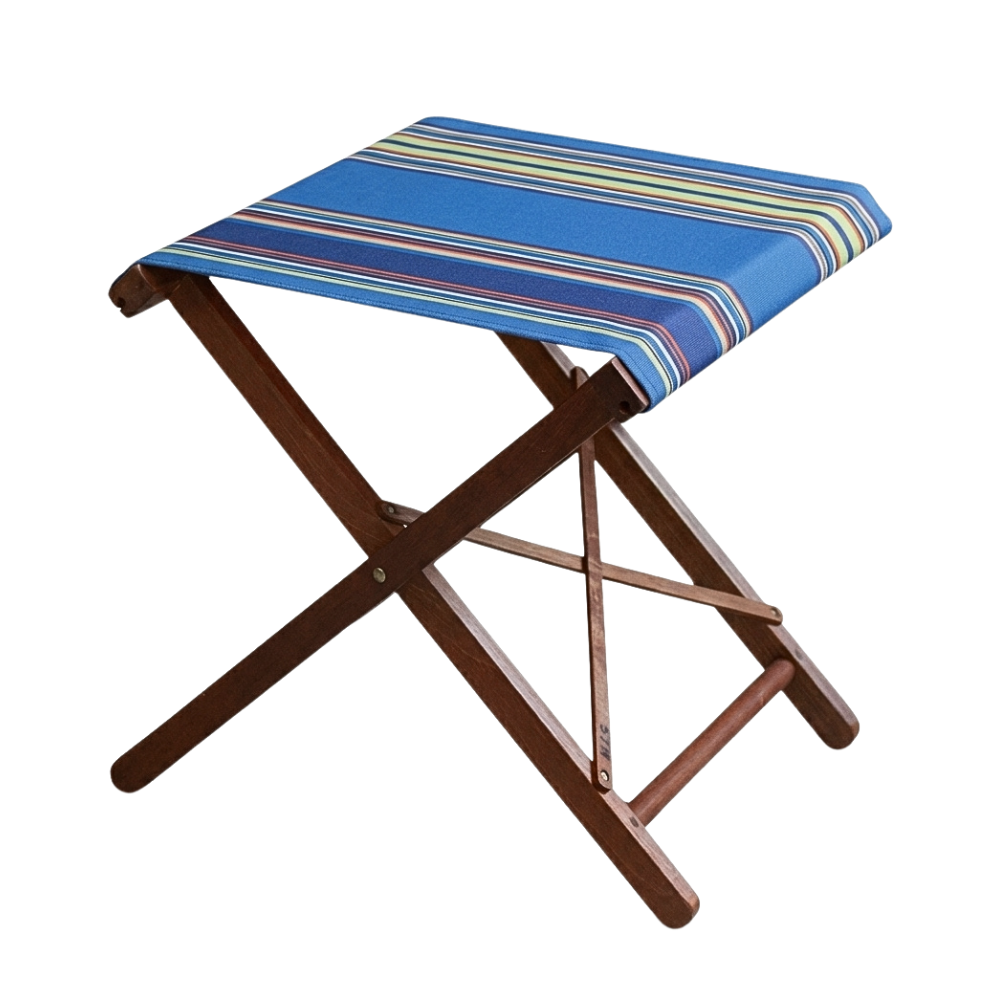 Wooden folding stool with multi-coloured striped outdoor fabric. Featuring blues, light green, orange, navy, and red. On a plain background