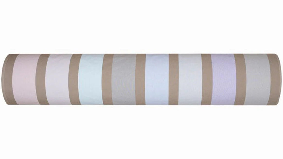 A roll of Hiver, a striped cotton Les Toiles du Soleil Fabric made up of pale blush, cool blues, soft lilac and warm taupe. 