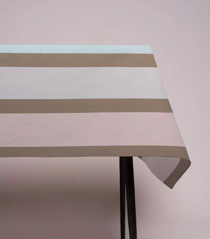Table cloth made from Hiver, a striped cotton Les Toiles du Soleil Fabric made up of pale blush, cool blues, soft lilac and warm taupe. 