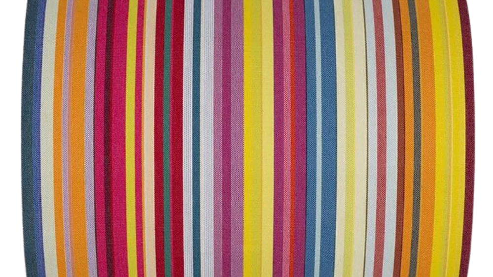 Colourful striped fabric on a white background. Featuring thin strips of yellow, purple, blue, orange and other vibrant colours