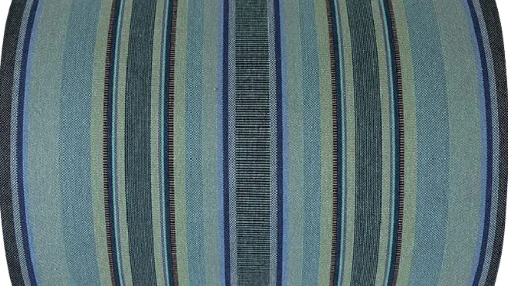 Multi-coloured striped cotton fabric roll. Featuring a variety of blues, turquoise, and shades of greens with a detailed weave. 