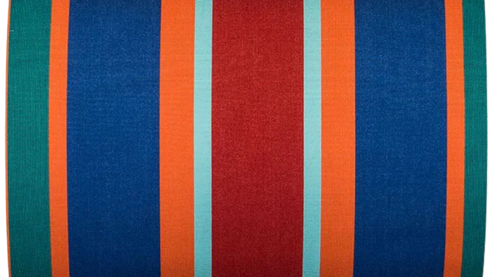 Bold striped cotton fabric featuring red, turquoise , orange, blue and teal. Made by Les Toiles du Soleil. 