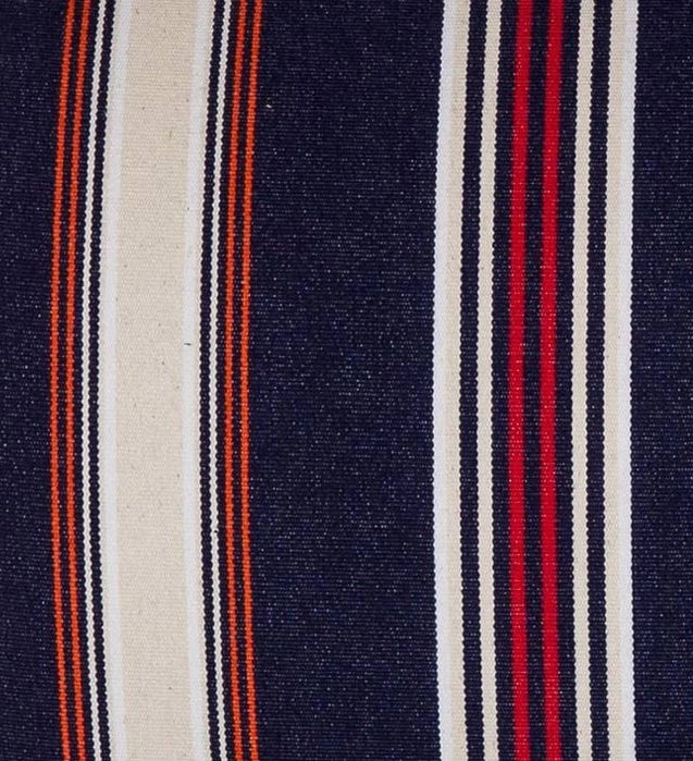 Close up of fabric, featuring deep navy with fine stripes of écru/cream, red, orange, and black. 
