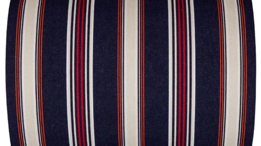 Fabric roll with deep navy with fine stripes of écru/cream, red, orange and black. On a white background